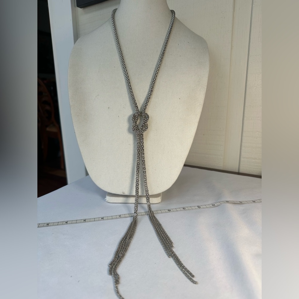 Long lariat style silvertone chain knot tassel necklace